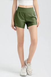 Full front view of dark green active shorts with elastic waist