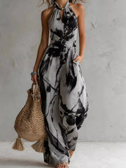 Grey and black ink-wash halter jumpsuit, full-length front view.