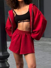 Back view of red hooded sweatshirt and matching shorts