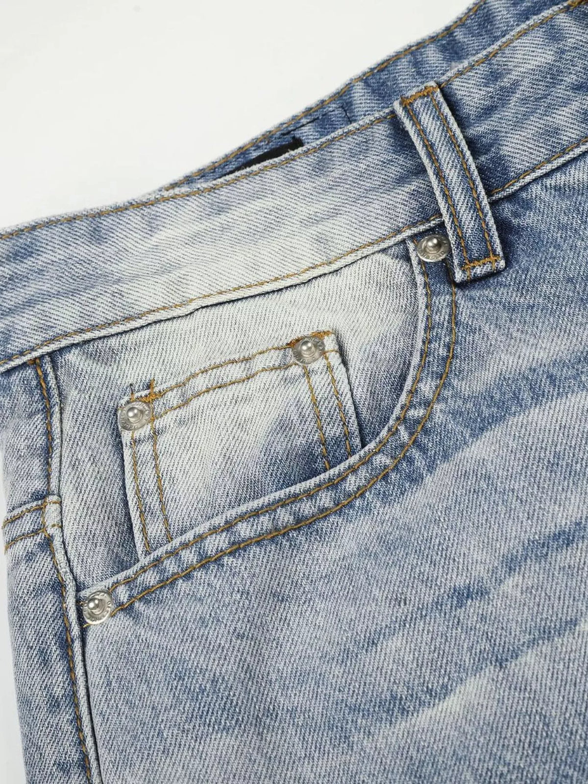 Close-up of front pocket and coin pocket on washed jeans