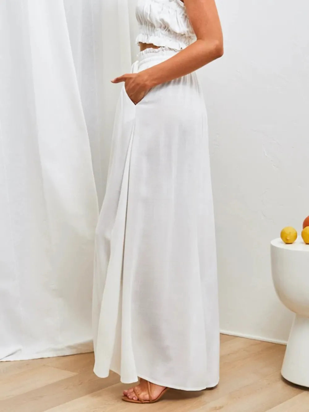 Side view of white flowing wide-leg pants