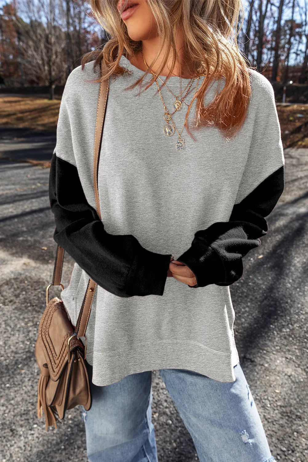 Front view of gray sweatshirt with black sleeves