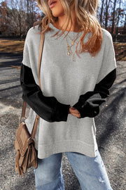 Front view of gray sweatshirt with black sleeves