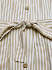 Close-up of button-front bodice and tied waist