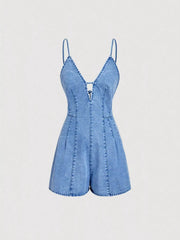 Light-wash denim romper displayed from the front with fitted waist and wide shorts