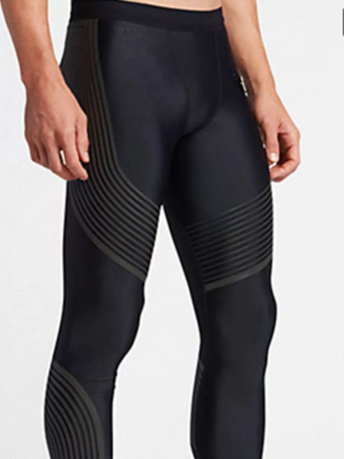 Close front view of black active leggings showing waistband and curved thigh lines
