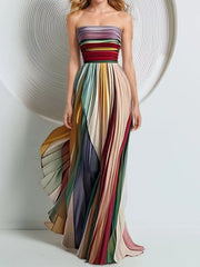 Side view showing the colorful pleated maxi skirt in motion