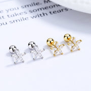 Flower stud earrings shown in silver-tone and gold-tone colour options
