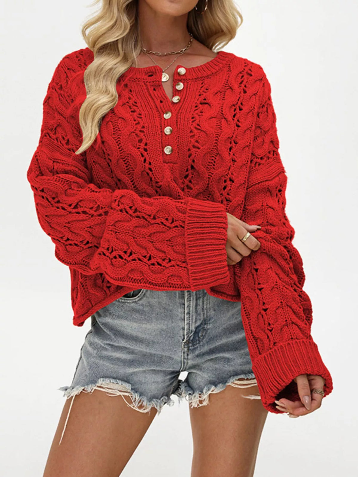 Women’s cable-knit half-button openwork sweater in red front view