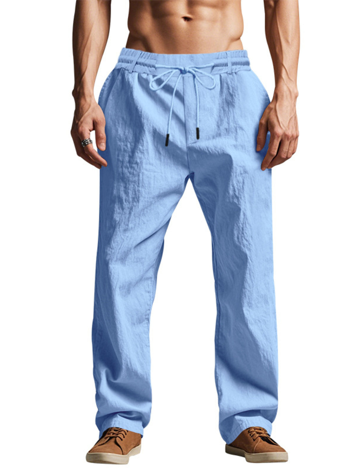 Model wearing light blue loose-fit pants, front view