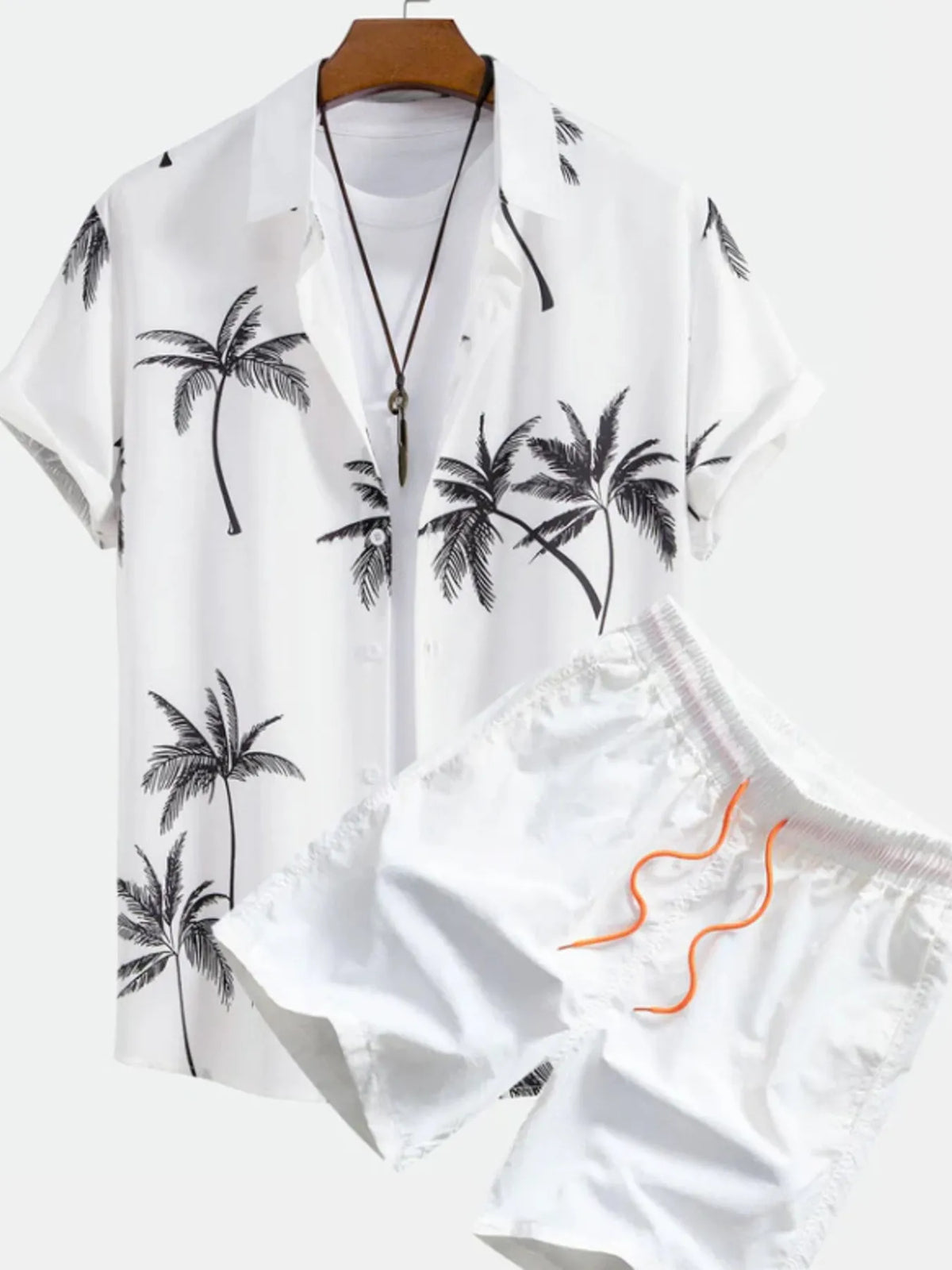 White short-sleeve button-front shirt and shorts with black palm tree print