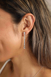 Adored 1.18 Carat Moissanite Long Earrings — Long moissanite earrings worn on an ear
