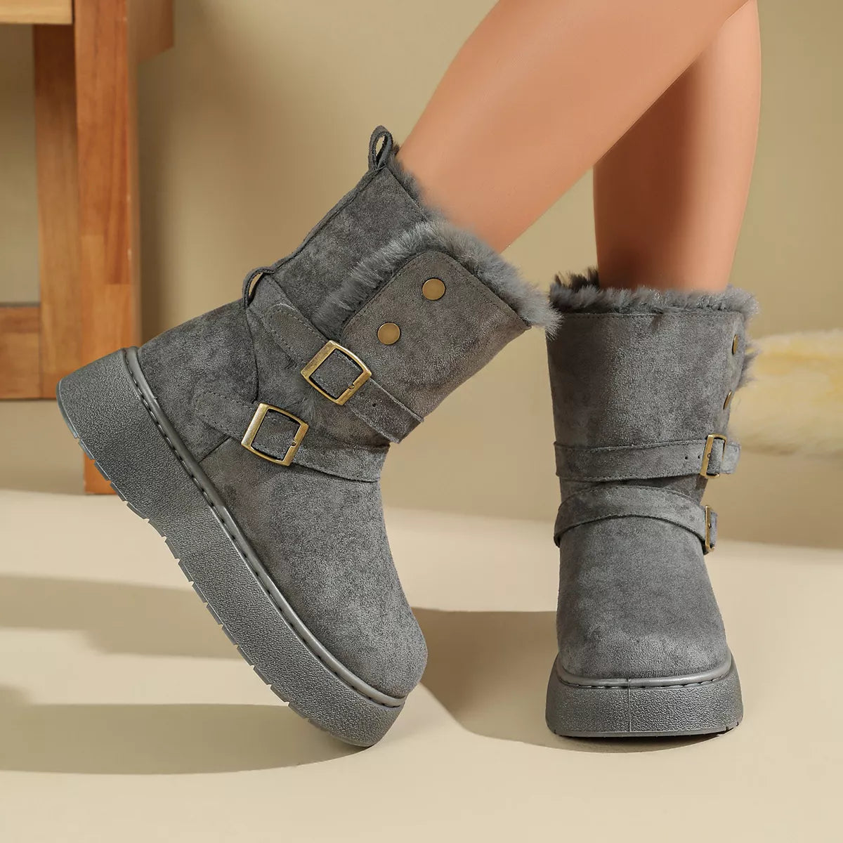 Gray, brown and dark brown buckle boots shown together