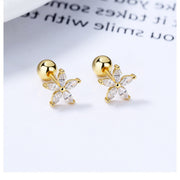 Pair of gold-tone flower studs with clear stones, front view