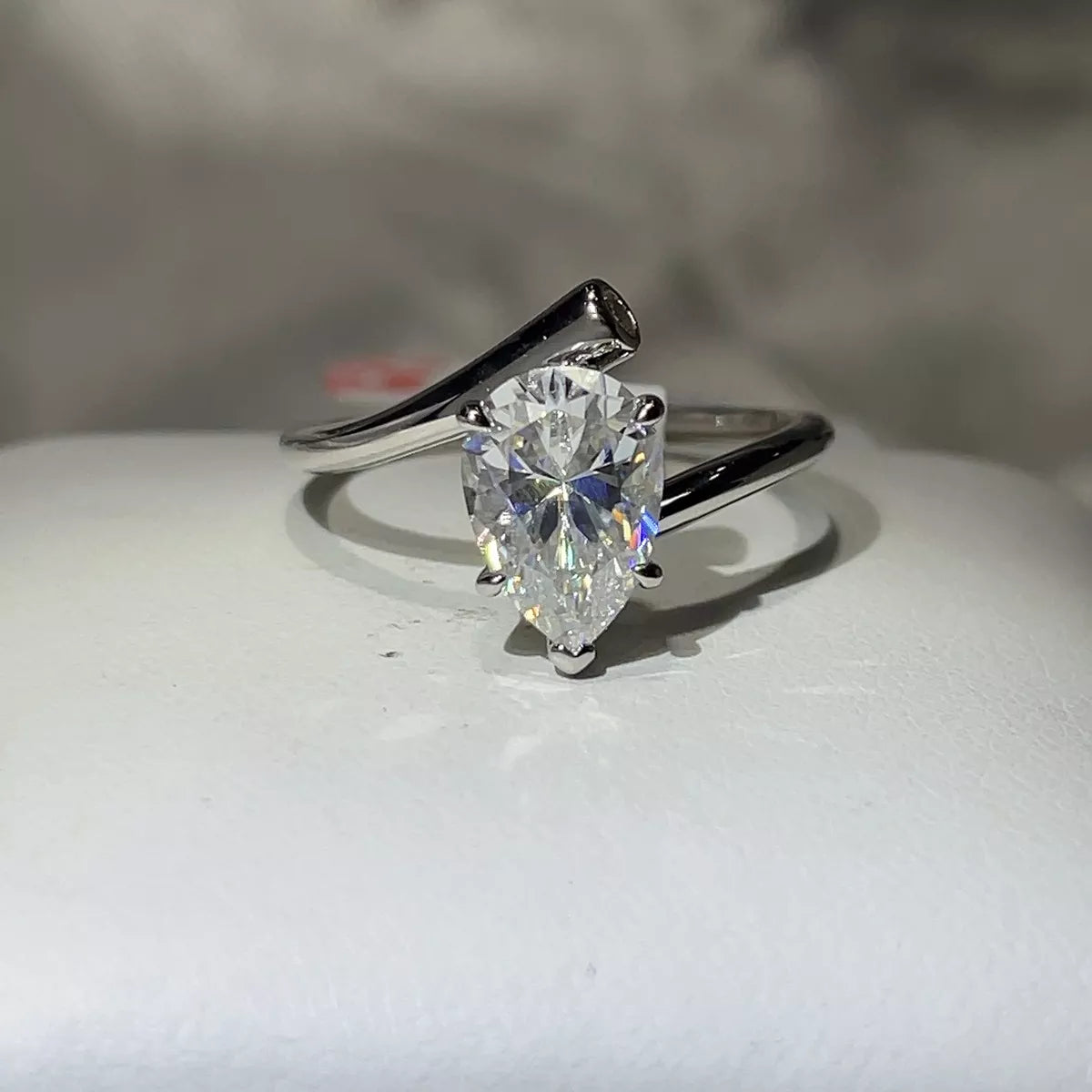 2 carat moissanite ring in sterling silver displayed on a light surface