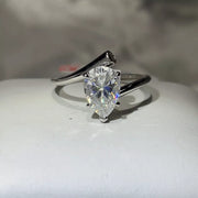 2 carat moissanite ring in sterling silver displayed on a light surface