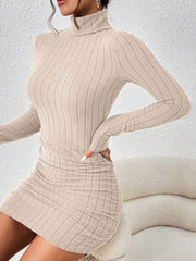 Angled view of beige dress showing ribbed knit