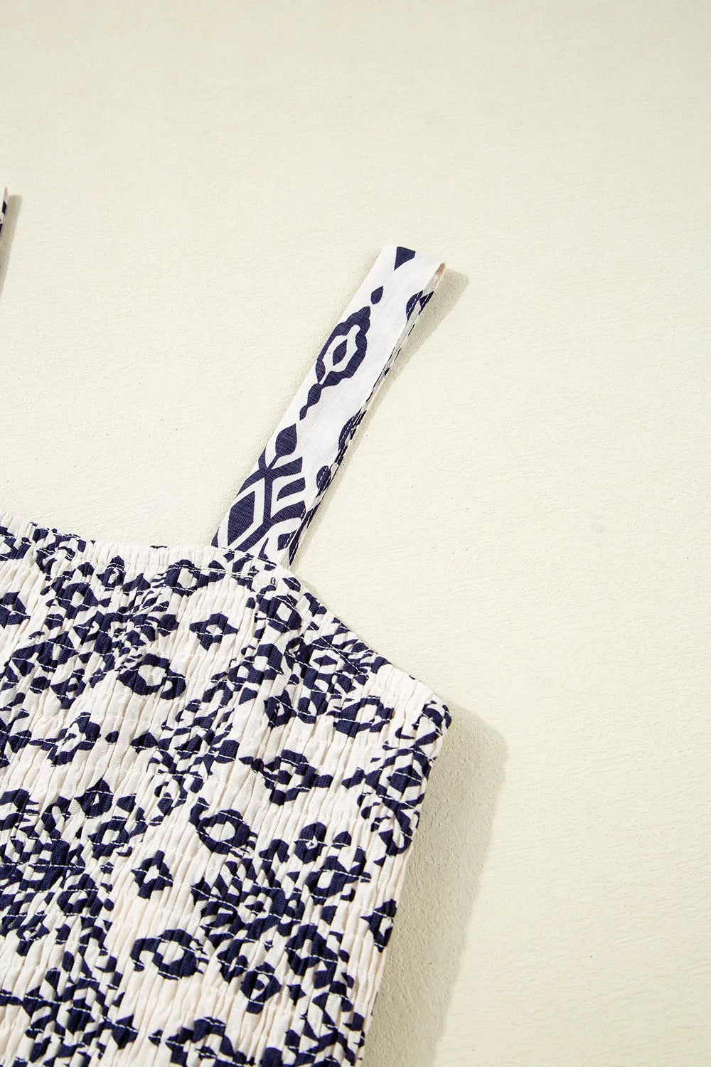 Close-up of wide shoulder strap and printed bodice