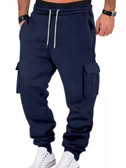 Model wearing navy cargo joggers, front view