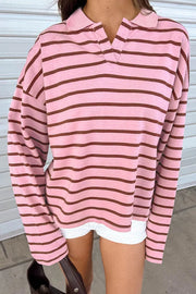 Front view of pink striped collared shirt with long sleeves.
