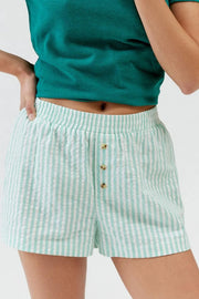 Mint green striped elastic-waist shorts, front view with buttons