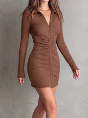 Three-quarter view of brown mini dress highlighting its buttons and ruching.