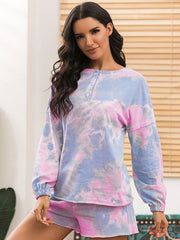 Model wearing pastel tie-dye long-sleeve top and matching shorts