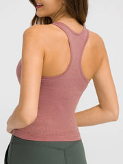 Back view of model wearing dusty rose racerback tank