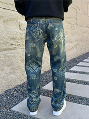 Straight back view of loose blue jeans with ornamental patterns