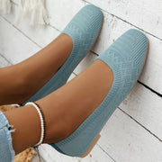 Sky blue mesh flats shown from above on feet