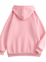 Back view of the pink hoodie with oversized hood and ribbed lower band