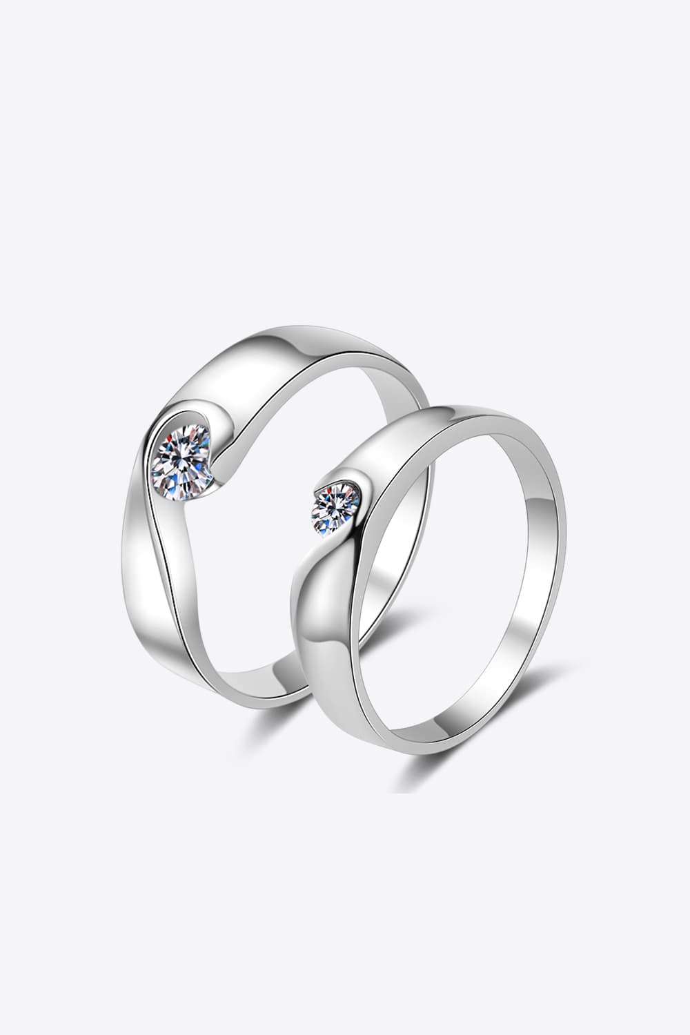 Two silver moissanite rings displayed together on a white background.