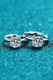 Close view of the stone-set fronts of huggie hoop earrings