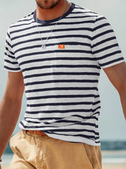 Front view of model wearing navy-and-white striped pocket T-shirt