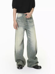 Angled front view of light-wash wide-leg jeans with faded thighs