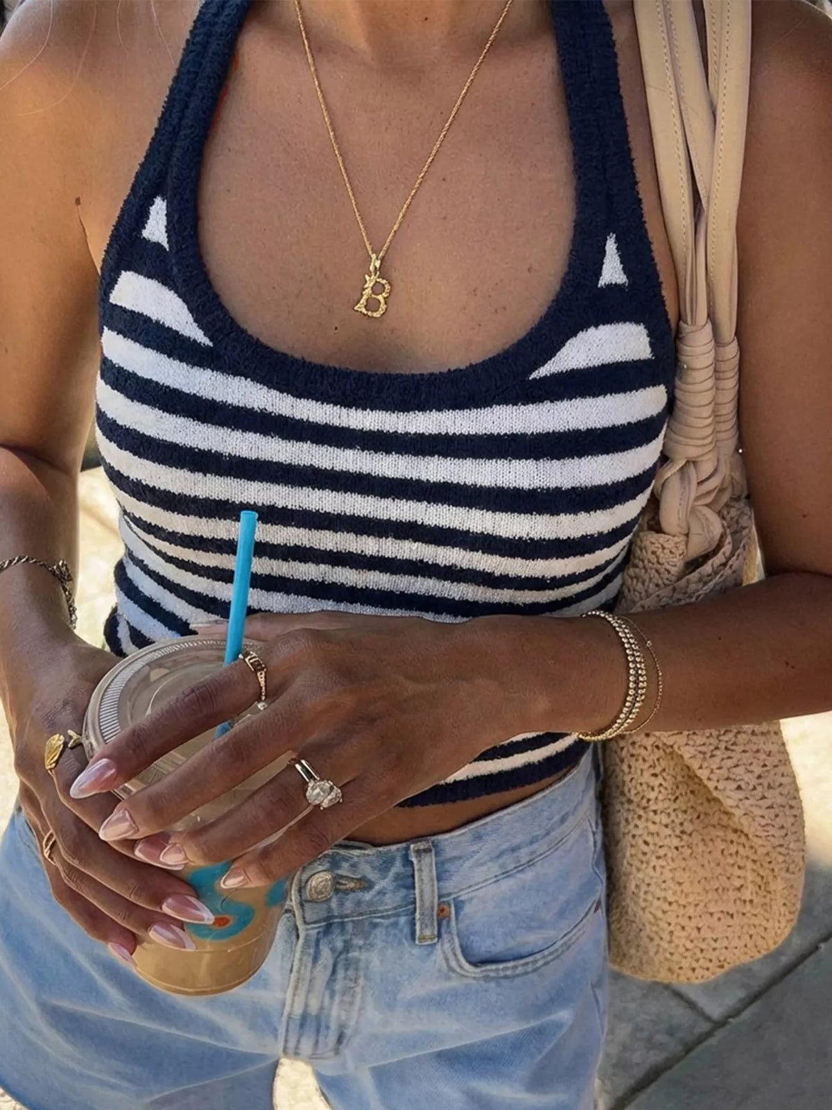 Cropped view of navy-and-white striped halter cami on model