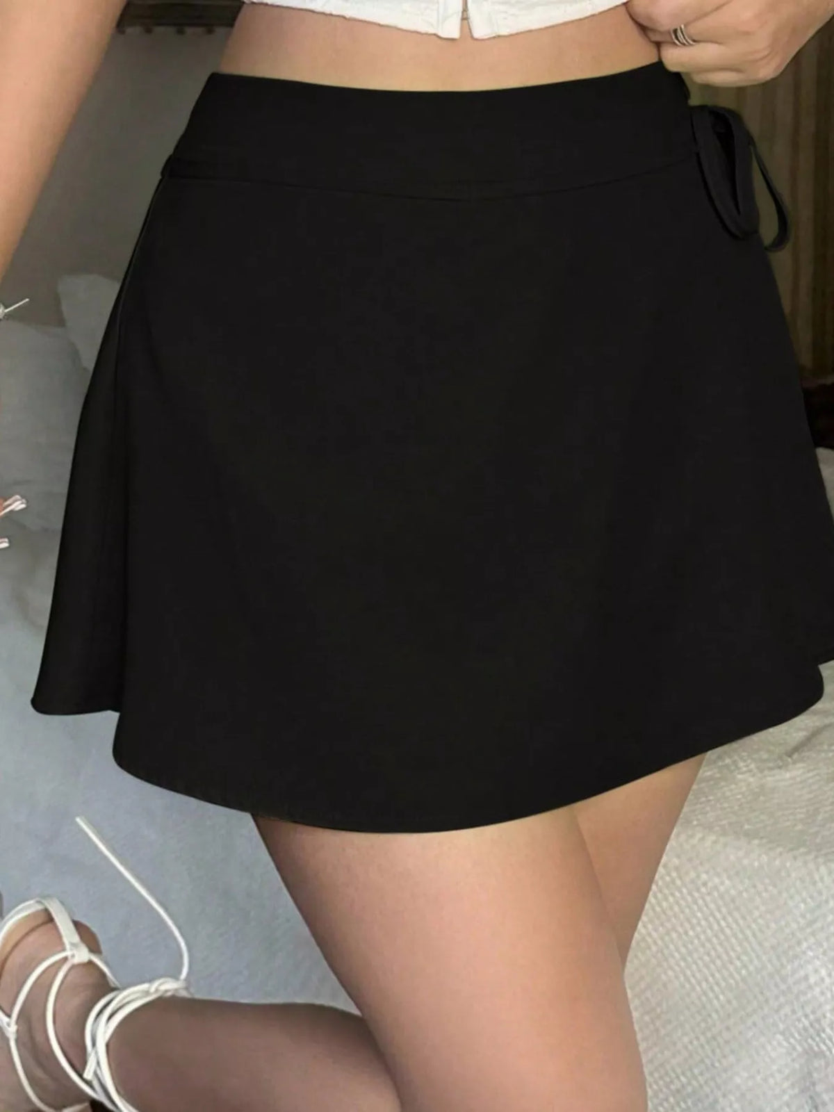 Black mini skort with smooth flared skirt front