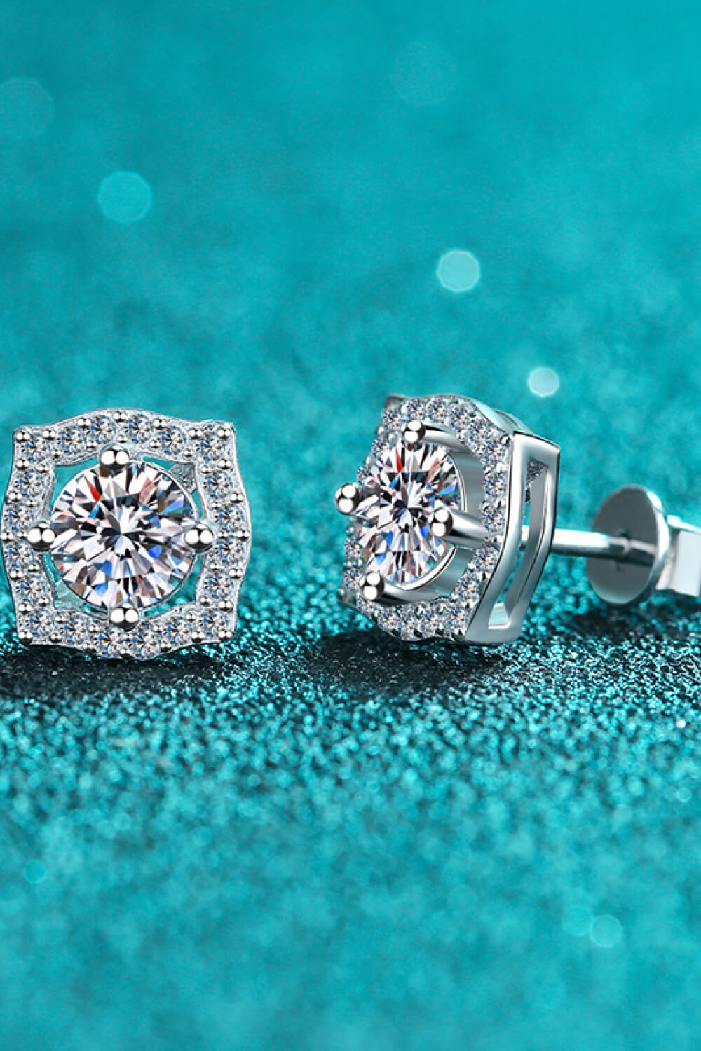 1 Carat Moissanite Geometric Stud Earrings — Front view of geometric studs on teal background