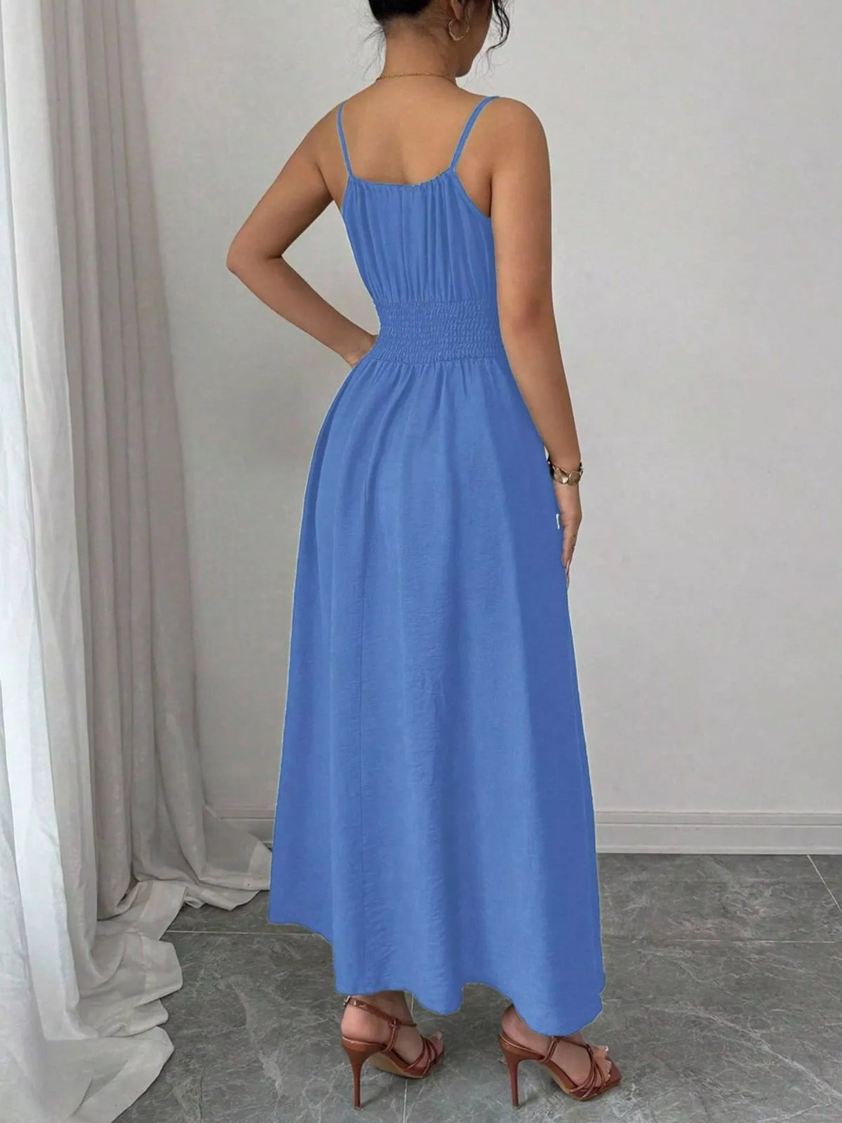 Blue smocked midi dress, rear view