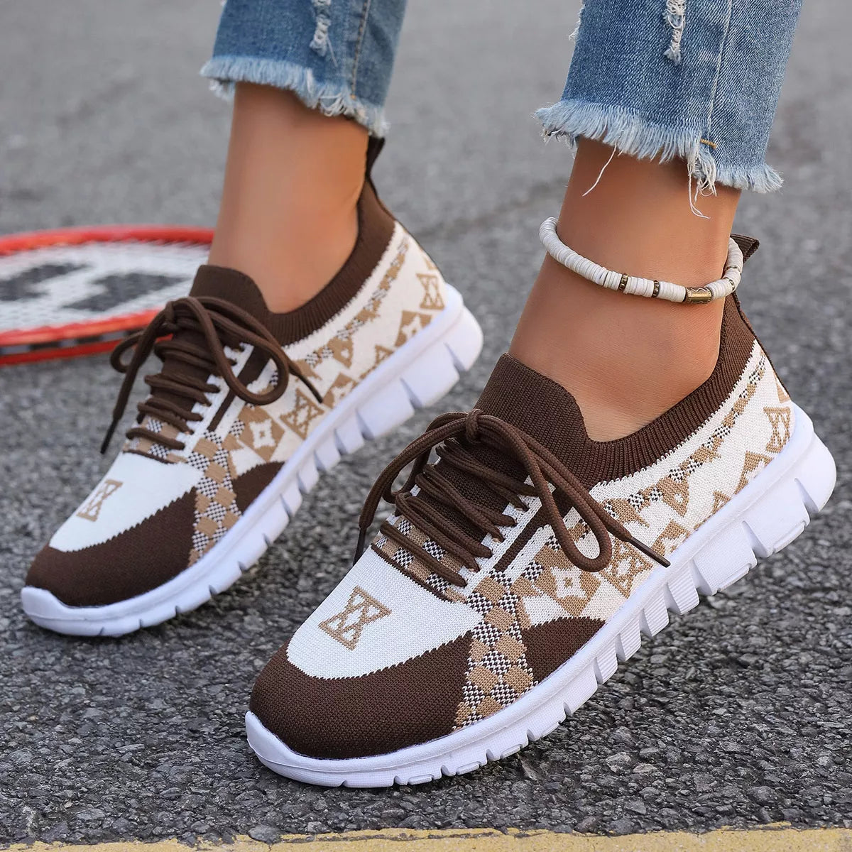 Pair of brown and cream mesh sneakers with white segmented soles