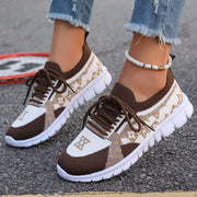 Pair of brown and cream mesh sneakers with white segmented soles