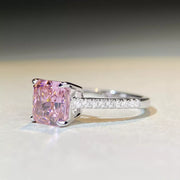 Side view of square pink stone ring