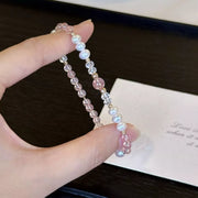 Close view of pearl and crystal beads on a wrist