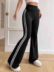 Black striped flare pants, rear three-quarter view