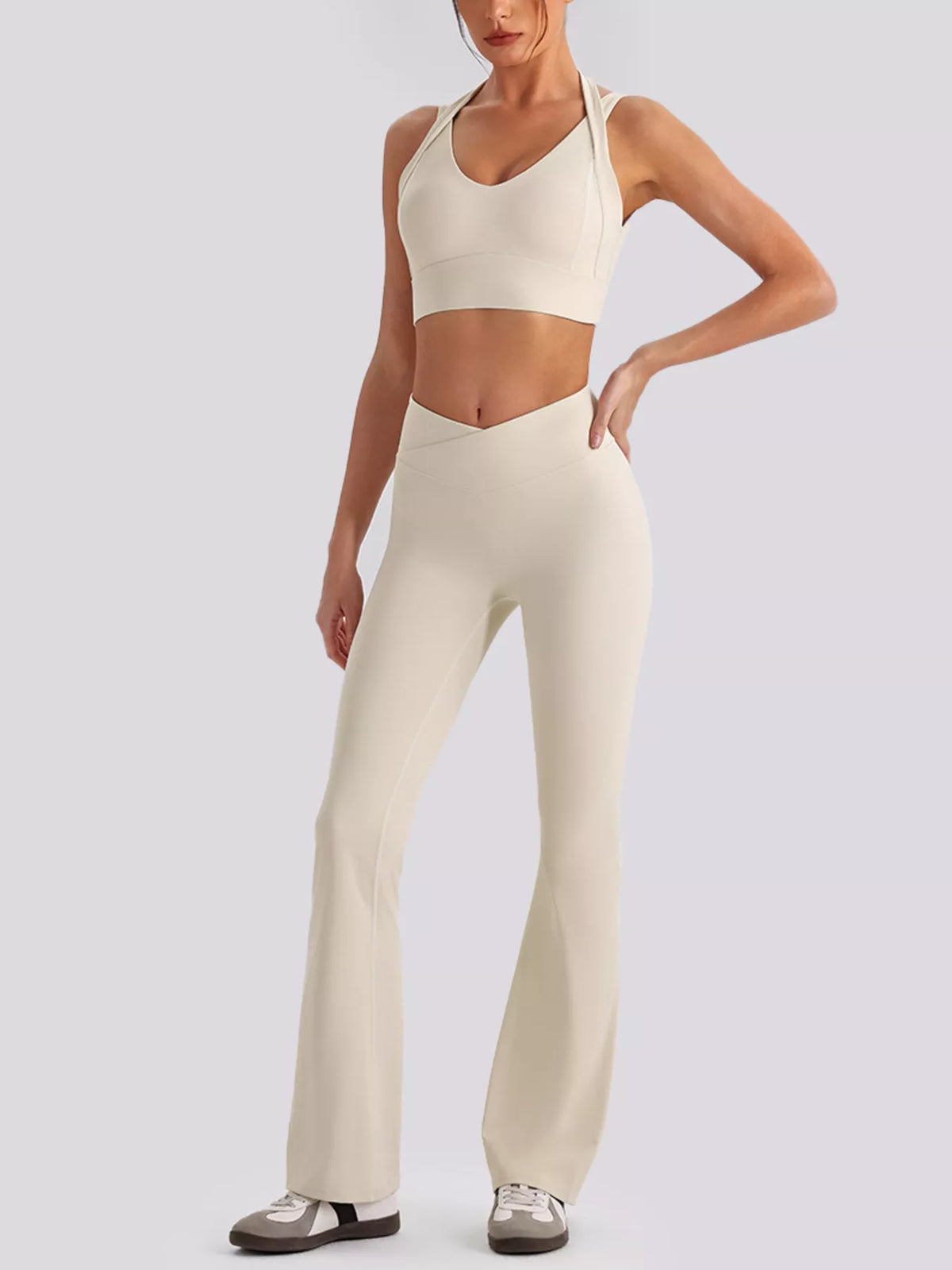 Three-quarter front view of seamless criss-cross v-neck tank and leggings active set