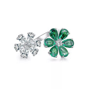 Detail of the green jeweled flower motif and clear central stones