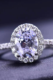 Platinum-plated oval moissanite ring shown from the side