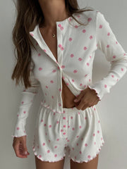 Model wearing white ribbed floral-print button-front top and matching shorts