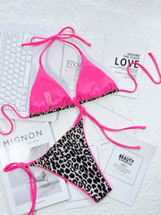Close-up of pink-trimmed leopard triangle bikini top
