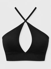 Black halter crop cami with crossed straps and teardrop front cutout, front view